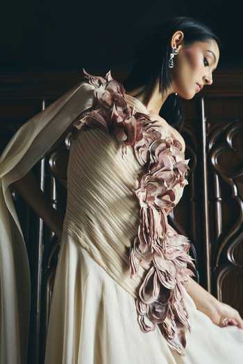 Supria Munjal Beige Organza Applique, Fabric Flowers Off-shoulder Couture Petal Work Gown at Aza Fashions Supria Munjal_Beige Organza Applique, Fabric Flowers Off-shoulder Couture Petal Work Gown _at_Aza_Fashions
