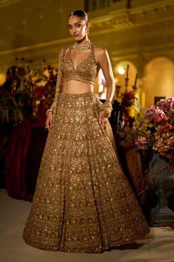 Buy_Seema Gujral_Gold Net Halter Neck Sequin Embroidered Bridal Lehenga Set _Online_at_Aza_Fashions