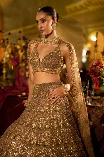 Shop_Seema Gujral_Gold Net Halter Neck Sequin Embroidered Bridal Lehenga Set _Online_at_Aza_Fashions