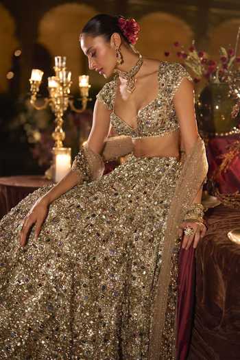 Seema Gujral_Gold Net Sweetheart Neck Jeweled Embroidered Lehenga Set _Online_at_Aza_Fashions