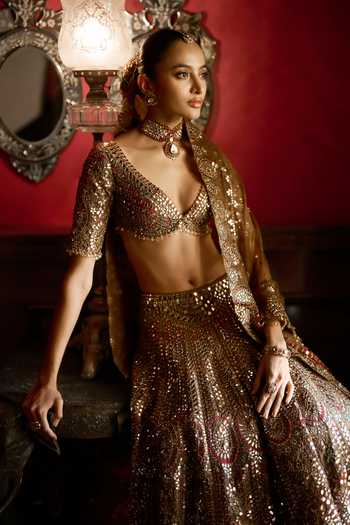 Seema Gujral_Gold Organza Plunge Neck Applique Mirror Work Bridal Lehenga Set _Online_at_Aza_Fashions
