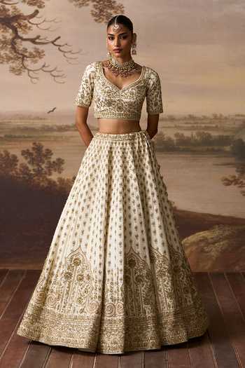 ANGAD SINGH Ivory Silk V-neck Chandni Raw Bridal Lehenga Blouse Set at Aza Fashions ANGAD SINGH_Ivory Silk V-neck Chandni Raw Bridal Lehenga Blouse Set _at_Aza_Fashions
