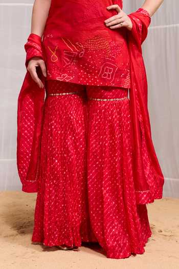 Naina Jain Red Silk High Neck, Yes Dhora Embroidered Kurta Gharara Set at Aza Fashions Naina Jain_Red Silk High Neck, Yes Dhora Embroidered Kurta Gharara Set _at_Aza_Fashions