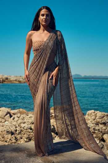 Shop Nitika Gujral Gold Satin, Net Bandeau Neck Champagne Crystal Pre-draped Saree With Blouse Online at Aza Fashions Shop_Nitika Gujral_Gold Satin, Net Bandeau Neck Champagne Crystal Pre-draped Saree With Blouse _Online_at_Aza_Fashions