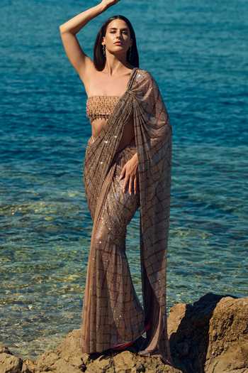 Buy Nitika Gujral Gold Satin, Net Bandeau Neck Champagne Crystal Pre-draped Saree With Blouse at Aza Fashions Buy_Nitika Gujral_Gold Satin, Net Bandeau Neck Champagne Crystal Pre-draped Saree With Blouse _at_Aza_Fashions