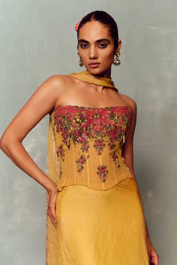 Buy Dolly J Yellow Organza, Net, Tulle Stones Bandeau Neck Soleil Bloom Corset Skirt Set Online at Aza Fashions Buy_Dolly J_Yellow Organza, Net, Tulle Stones Bandeau Neck Soleil Bloom Corset Skirt Set _Online_at_Aza_Fashions