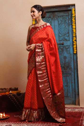 Shop Geroo Jaipur Orange Silk One Handcrafted Bandhani Saree With Stitched Blouse And Petticoat Online at Aza Fashions Shop_Geroo Jaipur_Orange Silk One Handcrafted Bandhani Saree With Stitched Blouse And Petticoat _Online_at_Aza_Fashions