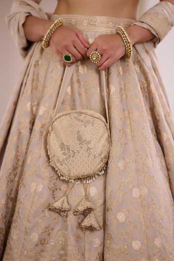 Safaa_Ivory Vegan Silk, Shantoon Square Neck Angoori Rasgulla Floral Zari Lehenga Set _at_Aza_Fashions