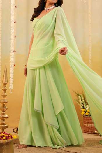 Shop B'Infinite Green Pastel Ruffle Embellished Draped Saree With Blouse For Kids Online at Aza Fashions Shop_B'Infinite_Green Pastel Ruffle Embellished Draped Saree With Blouse For Kids_Online_at_Aza_Fashions