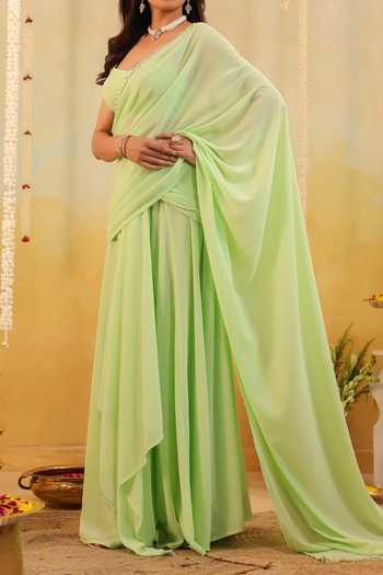 Buy B'Infinite Green Pastel Ruffle Embellished Draped Saree With Blouse For Kids Buy_B'Infinite_Green Pastel Ruffle Embellished Draped Saree With Blouse For Kids