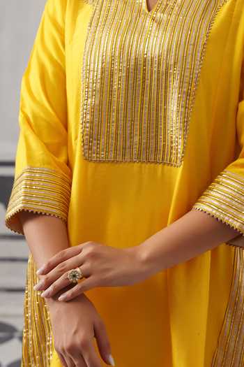 Palak & Mehak_Yellow Chanderi, Muslin Split V-neck, Yes Heera Embellished Kurta Set _at_Aza_Fashions