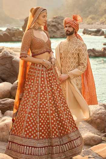 Buy Nitika Gujral Rust Silk, Net, Velvet Sweetheart Neck Amber Lehenga Set Buy_Nitika Gujral_Rust Silk, Net, Velvet Sweetheart Neck Amber Lehenga Set