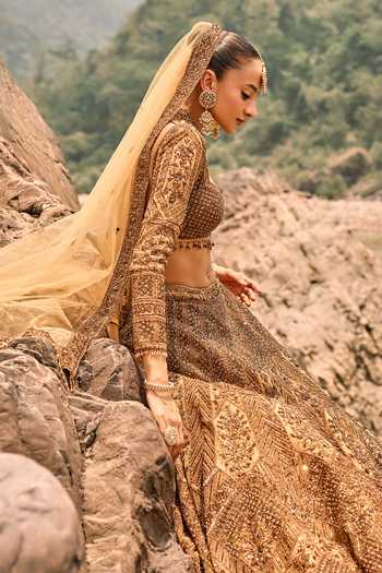 Buy Nitika Gujral Gold Net Sweetheart Neck Copper Jewelled Lehenga Set Online at Aza Fashions Buy_Nitika Gujral_Gold Net Sweetheart Neck Copper Jewelled Lehenga Set _Online_at_Aza_Fashions