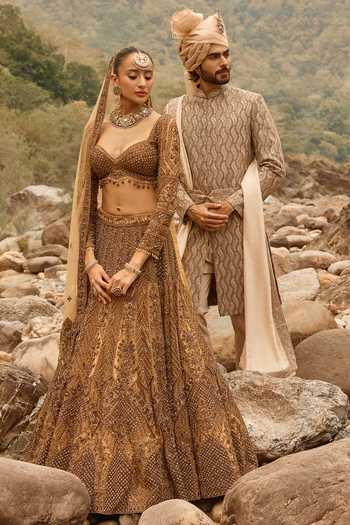 Shop Nitika Gujral Gold Net Sweetheart Neck Copper Jewelled Lehenga Set Online at Aza Fashions Shop_Nitika Gujral_Gold Net Sweetheart Neck Copper Jewelled Lehenga Set _Online_at_Aza_Fashions
