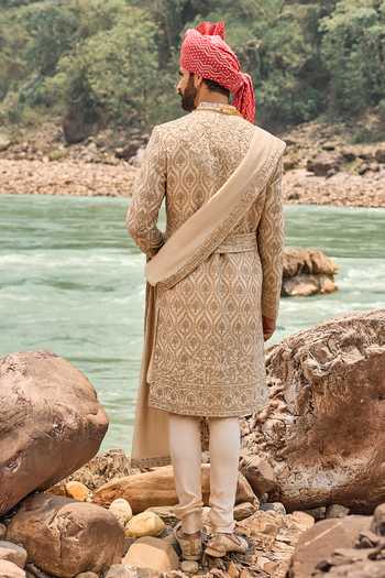 Shop Nitika Gujral Beige Silk, Cotton Floral Embroidered Sherwani Set at Aza Fashions Shop_Nitika Gujral_Beige Silk, Cotton Floral Embroidered Sherwani Set _at_Aza_Fashions