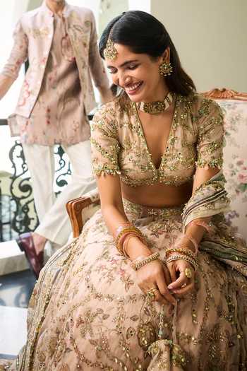 Mahima Mahajan Beige Silk Organza V-neck Ami Hand Work Embellished Lehenga Set Online at Aza Fashions Mahima Mahajan_Beige Silk Organza V-neck Ami Hand Work Embellished Lehenga Set _Online_at_Aza_Fashions
