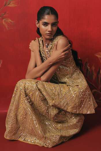 Shop Twenty Nine Gold Net Plunge Neck Sleeveless Embroidered Peplum Jacket Online at Aza Fashions Shop_Twenty Nine_Gold Net Plunge Neck Sleeveless Embroidered Peplum Jacket _Online_at_Aza_Fashions