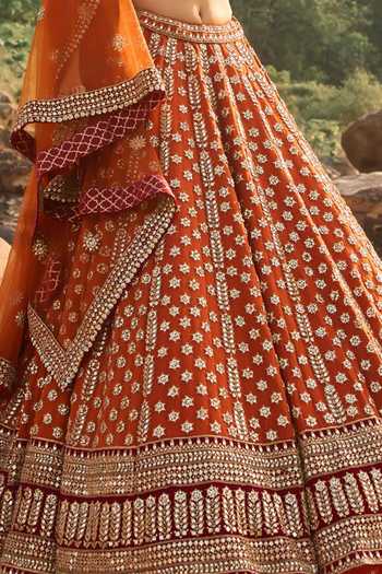 Shop Nitika Gujral Rust Silk, Net, Velvet Sweetheart Neck Amber Lehenga Set Shop_Nitika Gujral_Rust Silk, Net, Velvet Sweetheart Neck Amber Lehenga Set