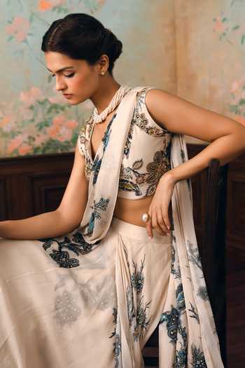 Paulmi And Harsh Ivory Chinon, Chiffon V-neck Wolfe Printed Pre-draped Saree With Blouse at Aza Fashions Paulmi And Harsh_Ivory Chinon, Chiffon V-neck Wolfe Printed Pre-draped Saree With Blouse _at_Aza_Fashions
