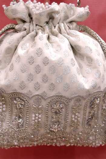 Shop AMYRA Silver Sequins, Beads, Pearls, Tassels, Lace Sitara Brocade Woven Potli Online at Aza Fashions Shop_AMYRA_Silver Sequins, Beads, Pearls, Tassels, Lace Sitara Brocade Woven Potli _Online_at_Aza_Fashions