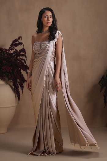 Shop Niamh By Kriti Gold Silk Satin, Shantoon Sequins, Champagne Cascade Draped Saree With Corset Online at Aza Fashions Shop_Niamh By Kriti_Gold Silk Satin, Shantoon Sequins, Champagne Cascade Draped Saree With Corset _Online_at_Aza_Fashions