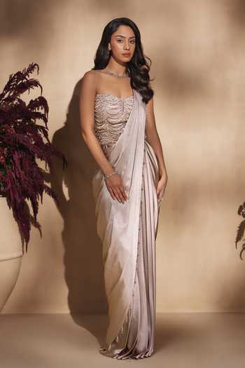 Niamh By Kriti Gold Silk Satin, Shantoon Sequins, Champagne Cascade Draped Saree With Corset at Aza Fashions Niamh By Kriti_Gold Silk Satin, Shantoon Sequins, Champagne Cascade Draped Saree With Corset _at_Aza_Fashions