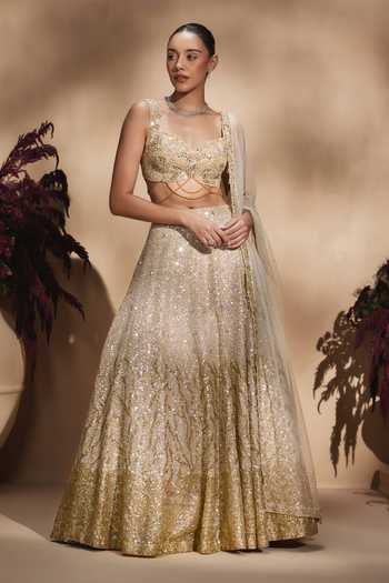Niamh By Kriti Gold Silk, Satin, Tissue Sweetheart Celestial Champagne Embellished Lehenga Set at Aza Fashions Niamh By Kriti_Gold Silk, Satin, Tissue Sweetheart Celestial Champagne Embellished Lehenga Set _at_Aza_Fashions