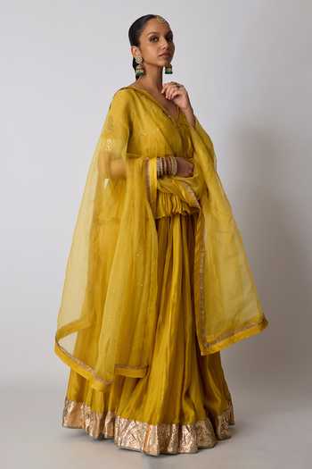Rhua_Yellow Chanderi Silk, Silk, Organza V-neck Kesari Embroidered Top Lehenga Set _at_Aza_Fashions