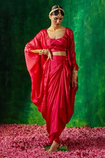 Buy Pink City By Sarika Red Silk Tassels, Embroidery Round Neck Bandhani Print Cape Skirt Set at Aza Fashions Buy_Pink City By Sarika_Red Silk Tassels, Embroidery Round Neck Bandhani Print Cape Skirt Set _at_Aza_Fashions