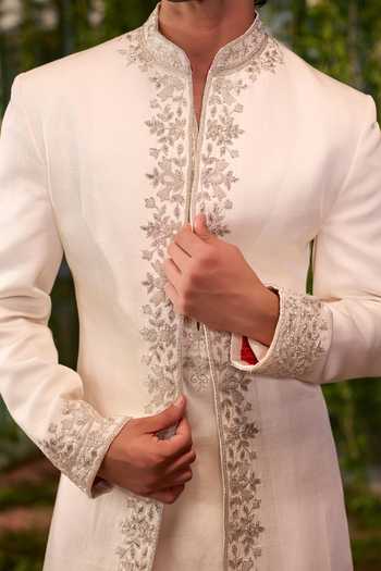 Shop Jigar & Nikita Ivory Satin Shvet Agni The Fearless King Sherwani Set Online at Aza Fashions Shop_Jigar & Nikita_Ivory Satin Shvet Agni The Fearless King Sherwani Set _Online_at_Aza_Fashions