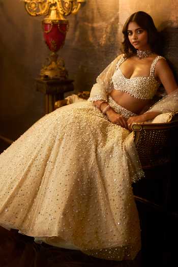 Seema Gujral Cream Net Plunge Neck Pearl Embellished Bridal Lehenga Set Online at Aza Fashions Seema Gujral_Cream Net Plunge Neck Pearl Embellished Bridal Lehenga Set _Online_at_Aza_Fashions