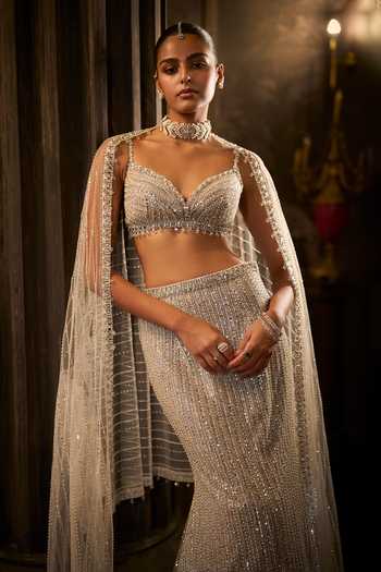 Buy Seema Gujral Silver Net Sweetheart Neck Sequin Work Fish Cut Bridal Lehenga Set Online at Aza Fashions Buy_Seema Gujral_Silver Net Sweetheart Neck Sequin Work Fish Cut Bridal Lehenga Set _Online_at_Aza_Fashions