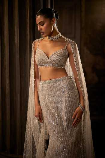 Shop Seema Gujral Silver Net Sweetheart Neck Sequin Work Fish Cut Bridal Lehenga Set Online at Aza Fashions Shop_Seema Gujral_Silver Net Sweetheart Neck Sequin Work Fish Cut Bridal Lehenga Set _Online_at_Aza_Fashions