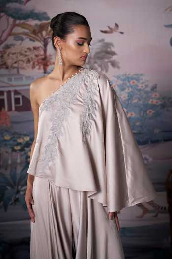 Shop_Amrta By Guneet Kondal_Ivory Satin One Shoulder Embroidered Draped Top And Pant Set _Online_at_Aza_Fashions