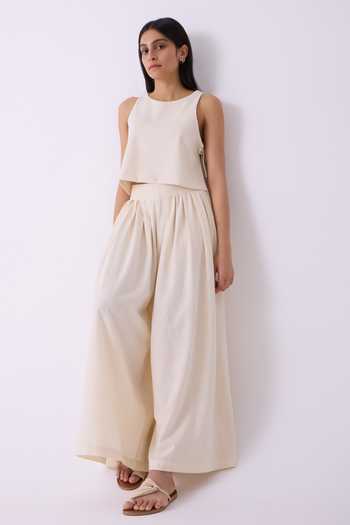 Buy The Summer House Off White Cotton Takumi Handwoven Pleated Pant Online at Aza Fashions Buy_The Summer House_Off White Cotton Takumi Handwoven Pleated Pant _Online_at_Aza_Fashions