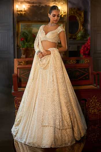 Buy_Seema Gujral_Ivory Net Sweetheart Neck Crystal Embroidered Lehenga Set _Online_at_Aza_Fashions