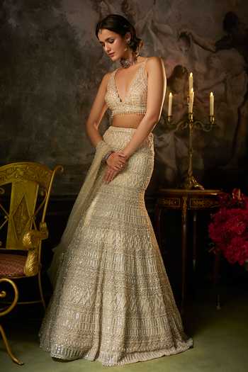 Shop Seema Gujral Gold Net Plunge Neck Geometric Embroidered Lehenga Set Online at Aza Fashions Shop_Seema Gujral_Gold Net Plunge Neck Geometric Embroidered Lehenga Set _Online_at_Aza_Fashions