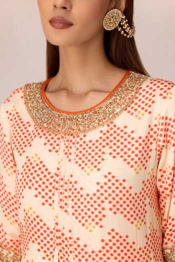 Shyam Narayan Prasad Ivory Satin, Modal Tassels Round Neck, Yes Bandhani Print Kurta And Dhoti Pant Set at Aza Fashions Shyam Narayan Prasad_Ivory Satin, Modal Tassels Round Neck, Yes Bandhani Print Kurta And Dhoti Pant Set _at_Aza_Fashions