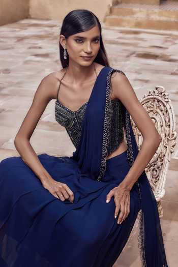 Buy_NIDHIKA SHEKHAR_Blue Georgette, Shantoon Ratnaneel Draped Saree With Embroidered Corset _Online_at_Aza_Fashions