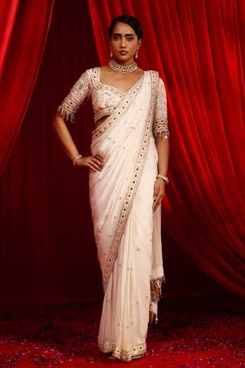 Buy NIDHIKA SHEKHAR Ivory Crepe Sanyoga Placement Embroidered Pre-draped Saree With Blouse Online at Aza Fashions Buy_NIDHIKA SHEKHAR_Ivory Crepe Sanyoga Placement Embroidered Pre-draped Saree With Blouse _Online_at_Aza_Fashions