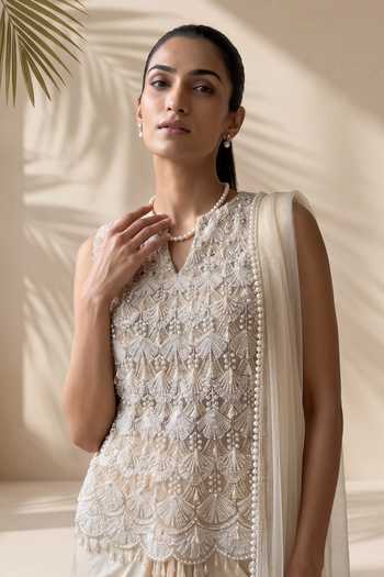 Shop Aneesh Agarwaal Ivory Net, Satin Split V-neck Wisteria Embroidered Top And Dhoti Skirt Set Online at Aza Fashions Shop_Aneesh Agarwaal_Ivory Net, Satin Split V-neck Wisteria Embroidered Top And Dhoti Skirt Set _Online_at_Aza_Fashions