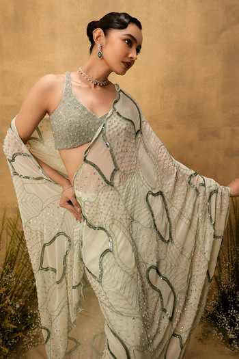 Quench A Thirst Green Georgette V-neck Hand Embroidered Pre-draped Saree And Blouse Set at Aza Fashions Quench A Thirst_Green Georgette V-neck Hand Embroidered Pre-draped Saree And Blouse Set _at_Aza_Fashions