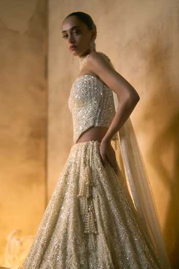 Buy Angad Singh Ivory Net Embroidery, Sequins, Beads, Pearls Bandeau Lumina Corset Lehenga Set Online at Aza Fashions Buy_Angad Singh_Ivory Net Embroidery, Sequins, Beads, Pearls Bandeau Lumina Corset Lehenga Set _Online_at_Aza_Fashions