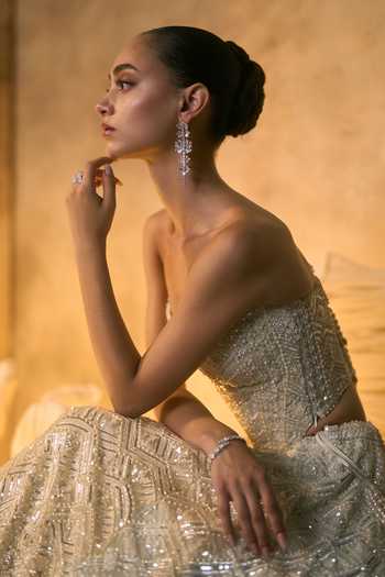 Angad Singh Ivory Net Embroidery, Sequins, Beads, Pearls Bandeau Lumina Corset Lehenga Set at Aza Fashions Angad Singh_Ivory Net Embroidery, Sequins, Beads, Pearls Bandeau Lumina Corset Lehenga Set _at_Aza_Fashions