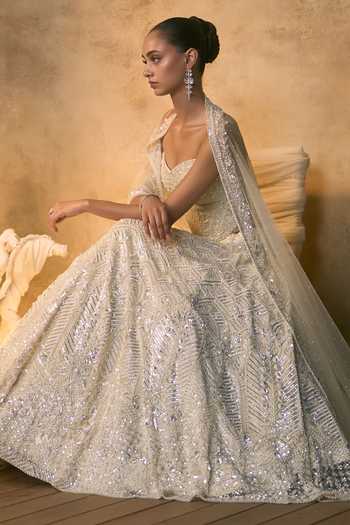 Shop Angad Singh Ivory Net Embroidery, Sequins, Beads, Pearls Bandeau Lumina Corset Lehenga Set Shop_Angad Singh_Ivory Net Embroidery, Sequins, Beads, Pearls Bandeau Lumina Corset Lehenga Set