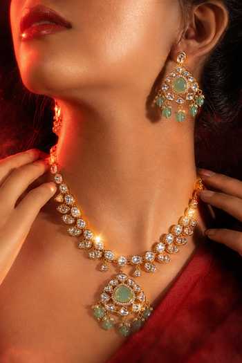 Shop Tussya Gold Plated Kundan Studded Necklace And Earrings Set Online at Aza Fashions Shop_Tussya_Gold Plated Kundan Studded Necklace And Earrings Set _Online_at_Aza_Fashions