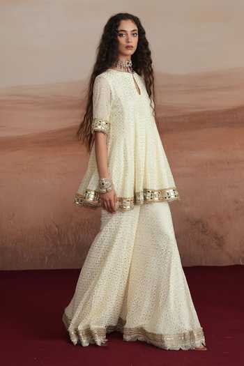 Shop_Mustard Moon By Neyha And Vrinda_Ivory Georgette Keyhole Neck Mishka Flared Short Kurta Sharara Set 