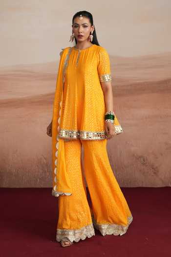 Mustard Moon By Neyha And Vrinda_Yellow Georgette Round Neck Mishka Flared Short Kurta Sharara Set _Online_at_Aza_Fashions