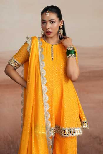 Buy_Mustard Moon By Neyha And Vrinda_Yellow Georgette Round Neck Mishka Flared Short Kurta Sharara Set _Online_at_Aza_Fashions