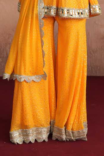 Shop_Mustard Moon By Neyha And Vrinda_Yellow Georgette Round Neck Mishka Flared Short Kurta Sharara Set _Online_at_Aza_Fashions